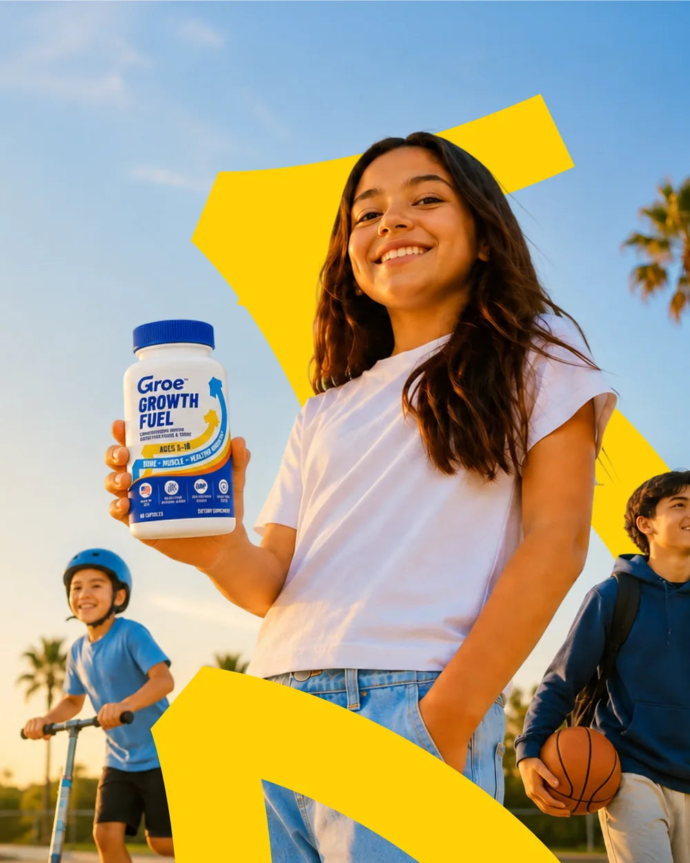 A smiling teenage girl holding a bottle of Groe Growth Fuel, with a boy on a scooter and a boy carrying a basketball behind her.